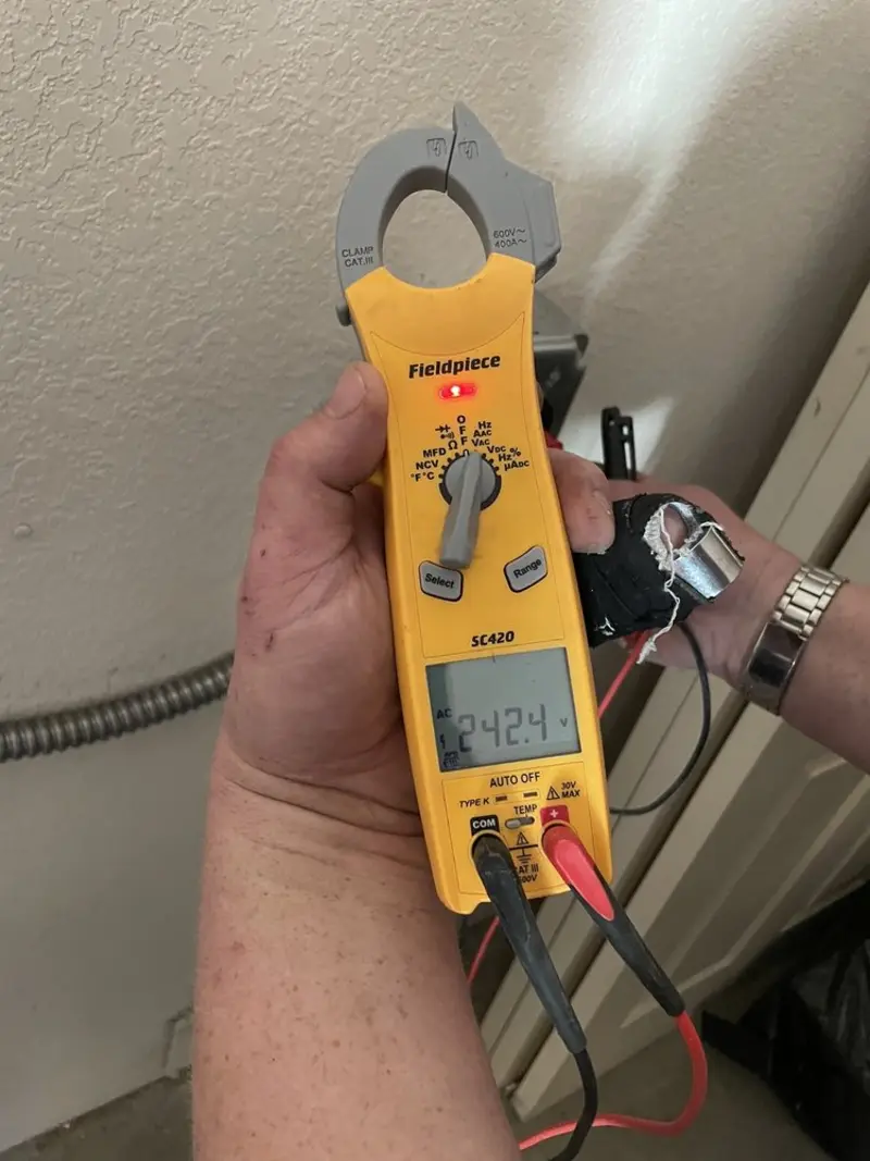 Voltage testing with clamp meter during Electrical Installation Services in Ivins